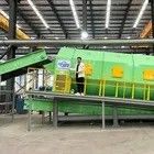 Máquina de triagem por tambor para sistema de triagem automática de sólidos dentro de uma instalação de triagem de resíduos